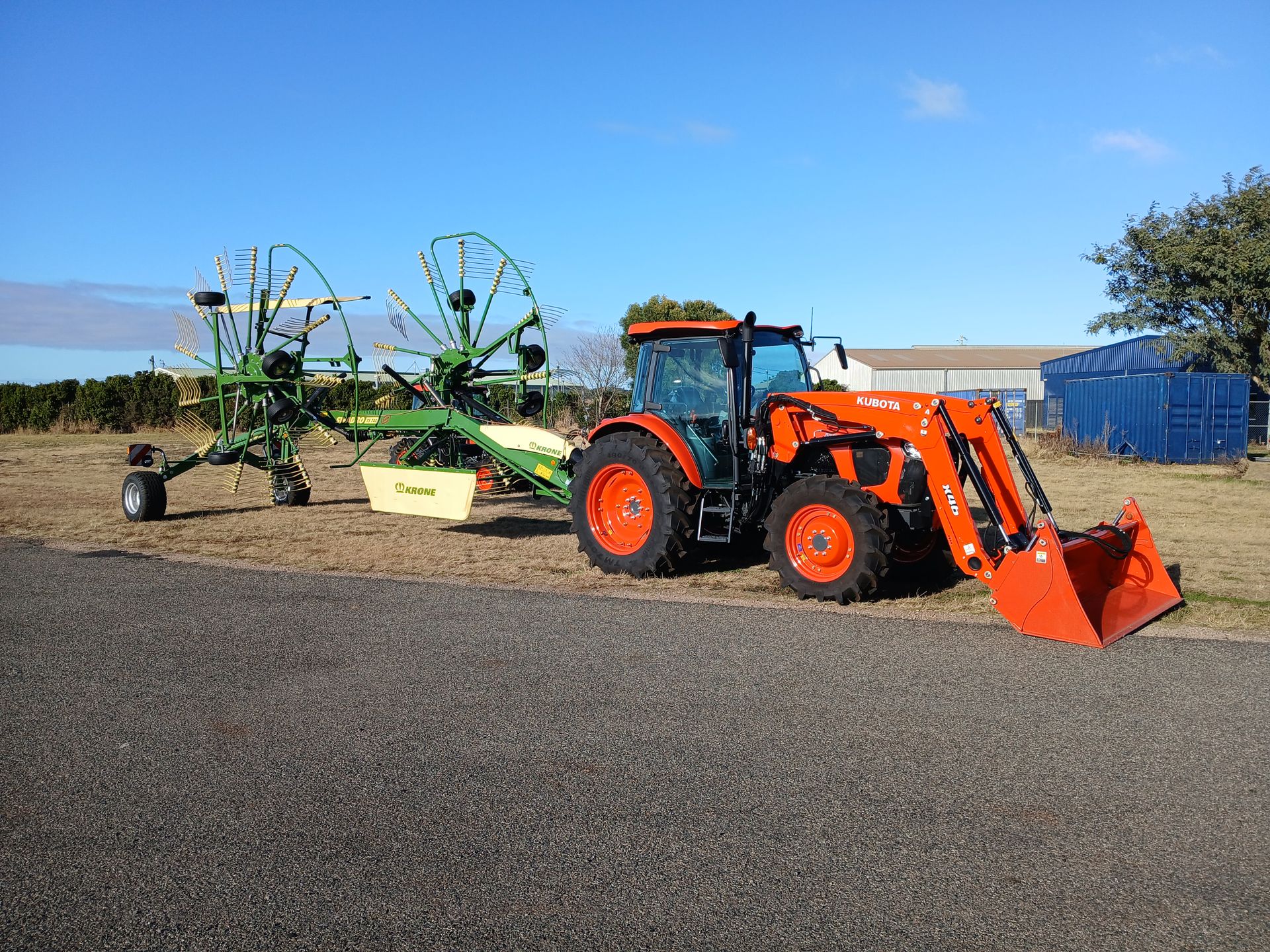 A Man is Working on a Lawn Mower on a Table — Ken Mills Machinery in Kingaroy, QLD