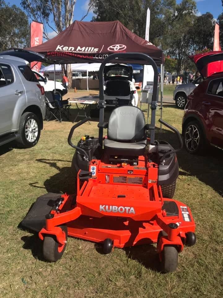 Red Kubota Zero-turn Mower on Grass at an Outdoor Equipment Display — Ken Mills Machinery in Kingaroy, QLD