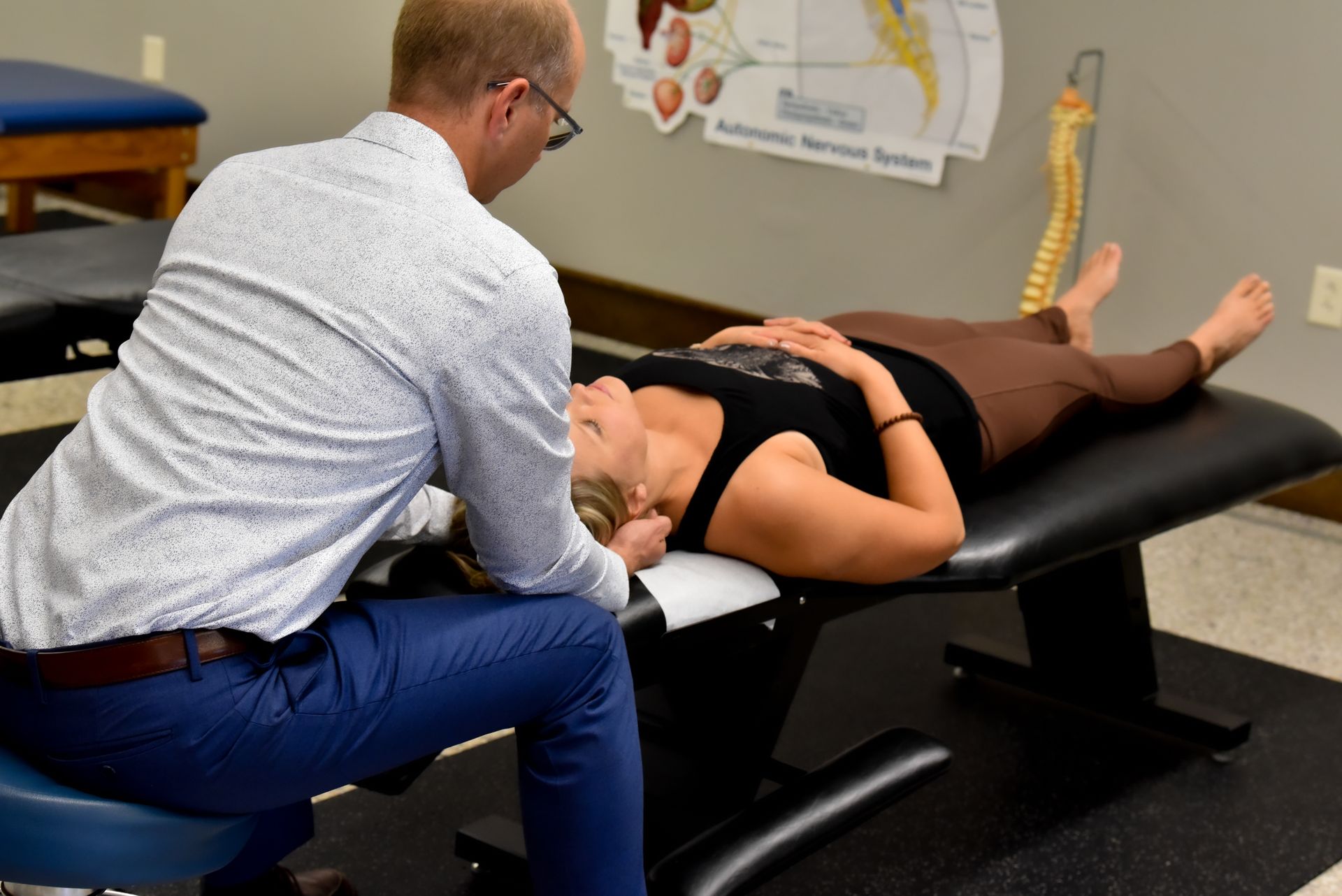 Dr. John adjusting a woman
