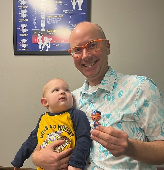 Dr. John taking care of a toddler