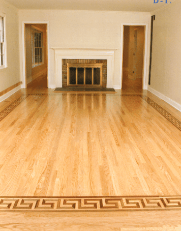 Empty hardwood living room with a fireplace and two wooden doors