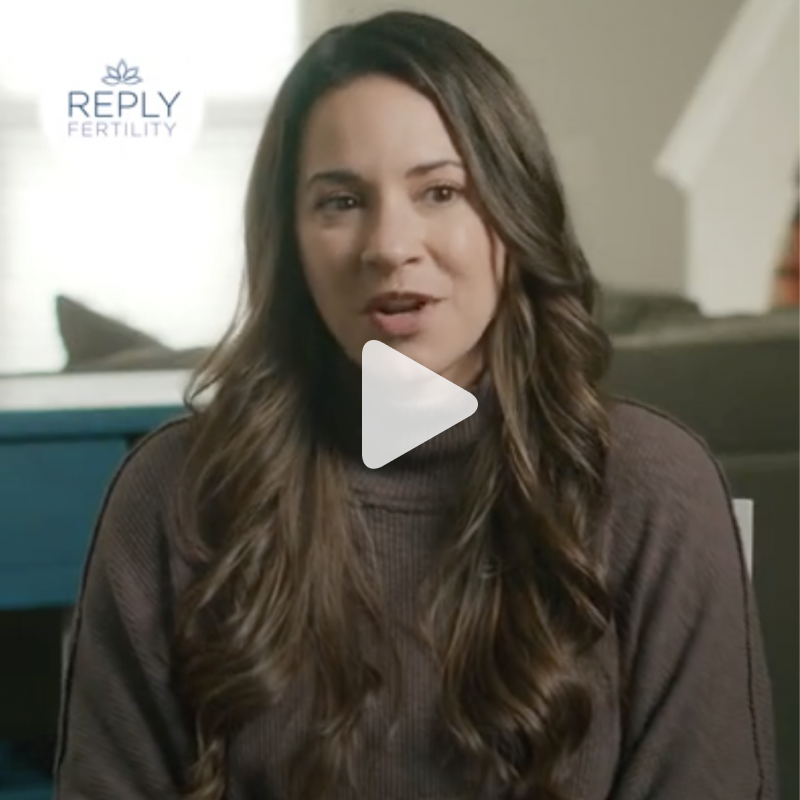 A video of a woman with reply fertility in the background