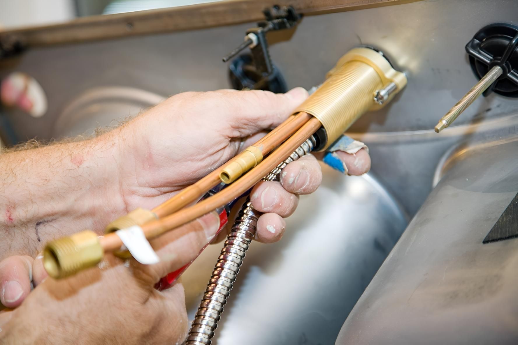 Person is Holding a Hose — Wet & Dry Plumbing & Gas in Newtown, QLD