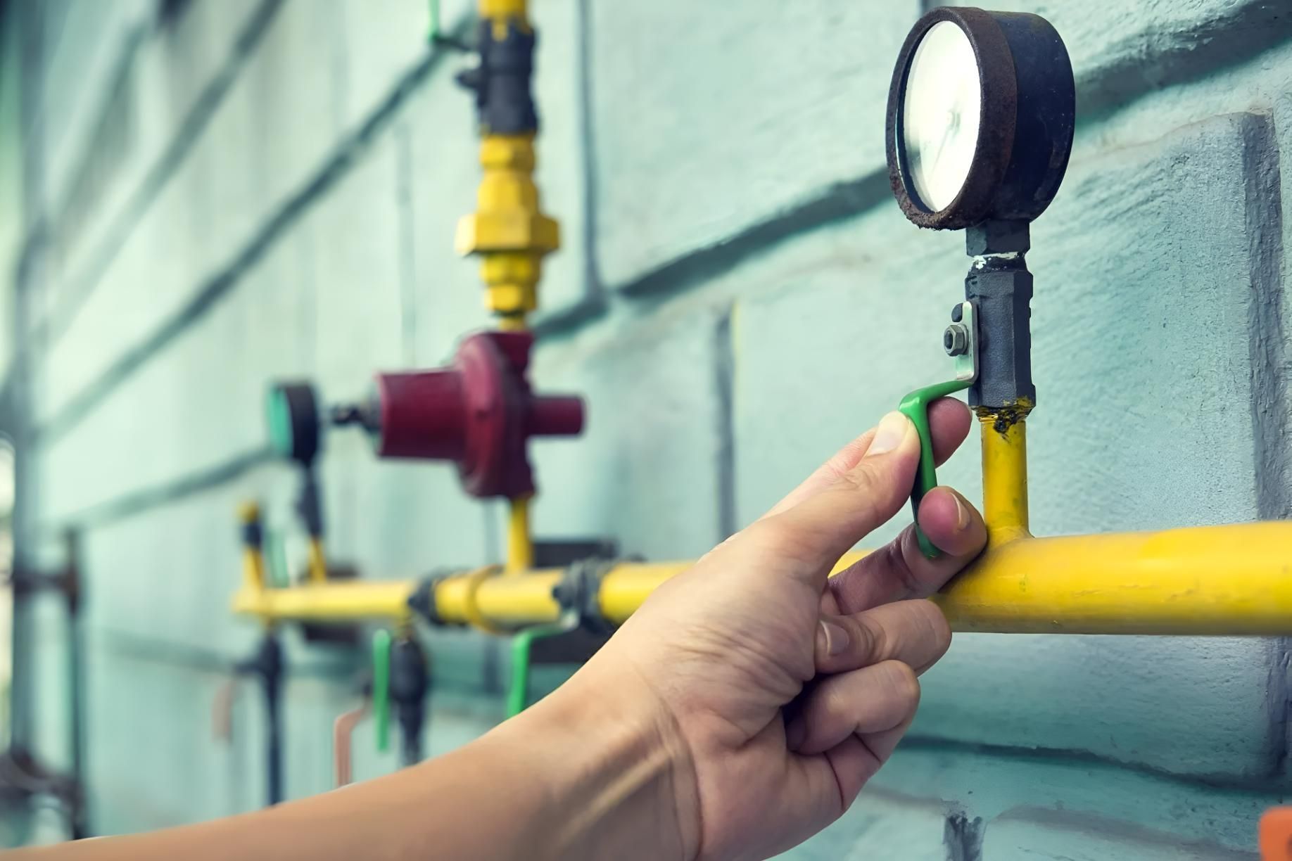 Person is Adjusting a Gas Pressure Gauge — Wet & Dry Plumbing & Gas in Newtown, QLD