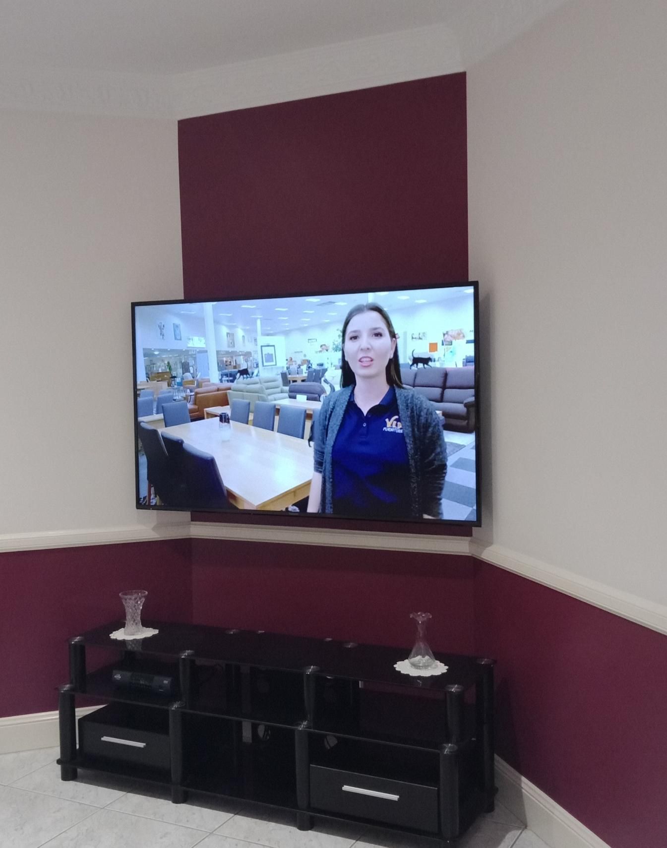 A Flat Screen Tv Shows A Woman In A Blue Shirt — Laurence Capocchi Antenna Guy In Trinity Beach, QLD