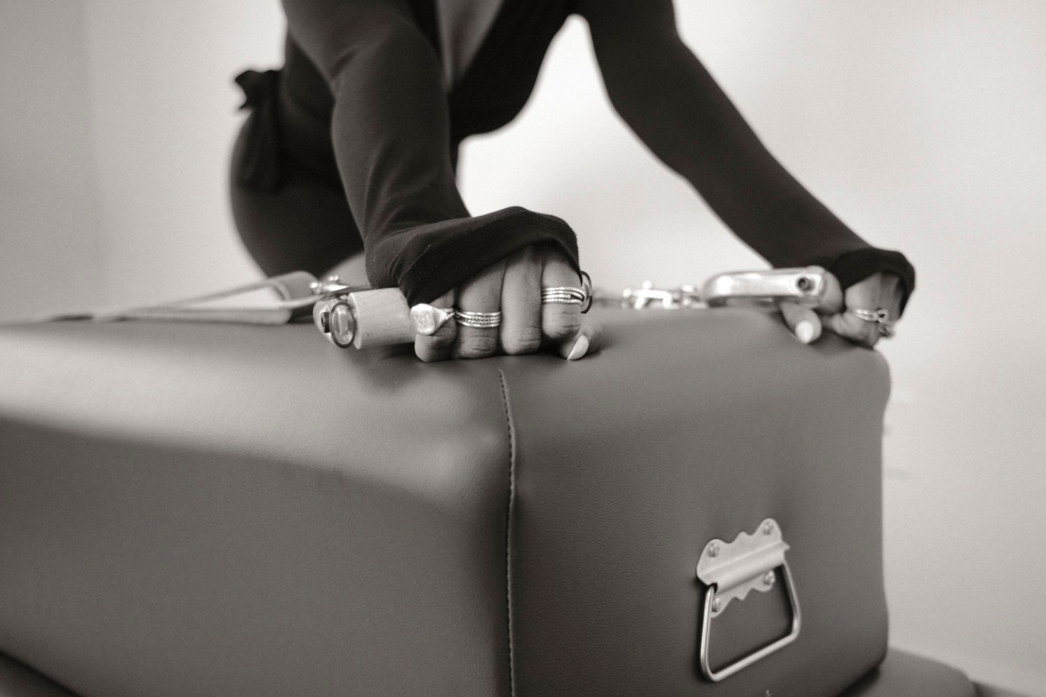 Person hands on pilates reformer box