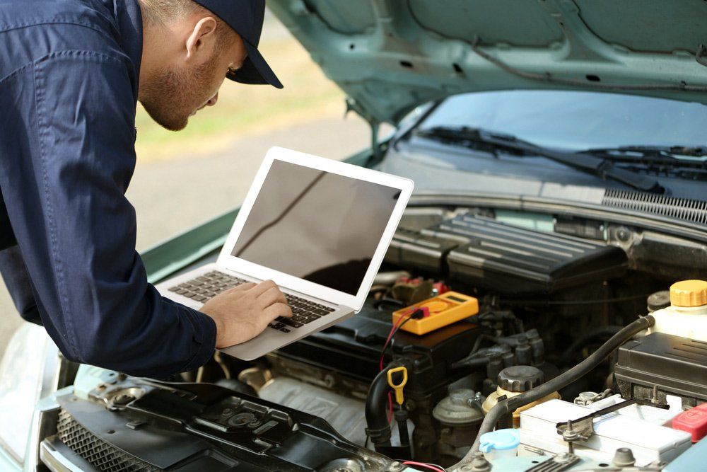Mechanic Repairman Inspecting Car — Jon Wilson Mechanical in Eaglehawk, VIC
