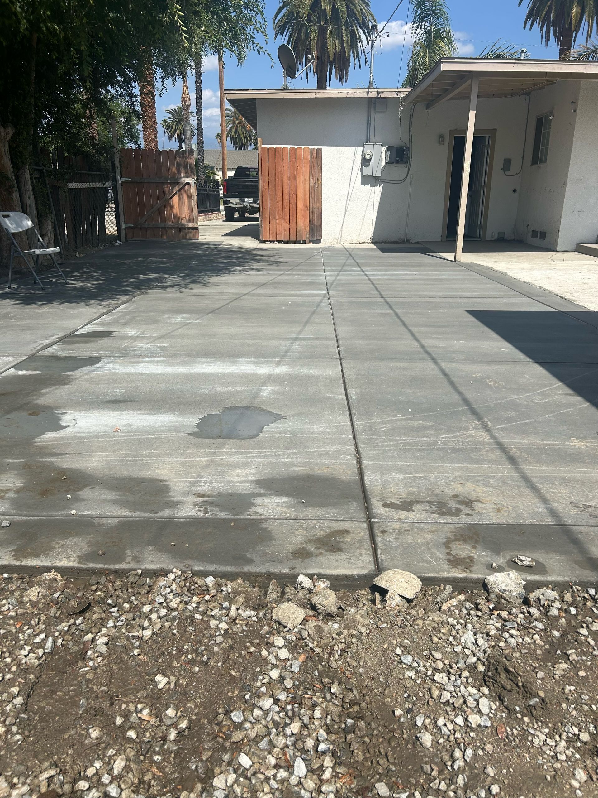 Concrete Pad Installation, Driveway Extension, Base Reinforcement, Concrete Pouring & Finishing