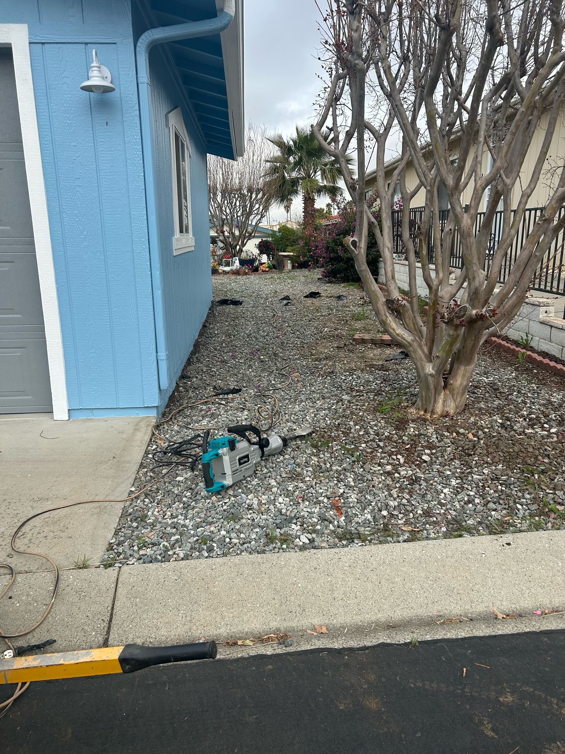 Front of a blue house.