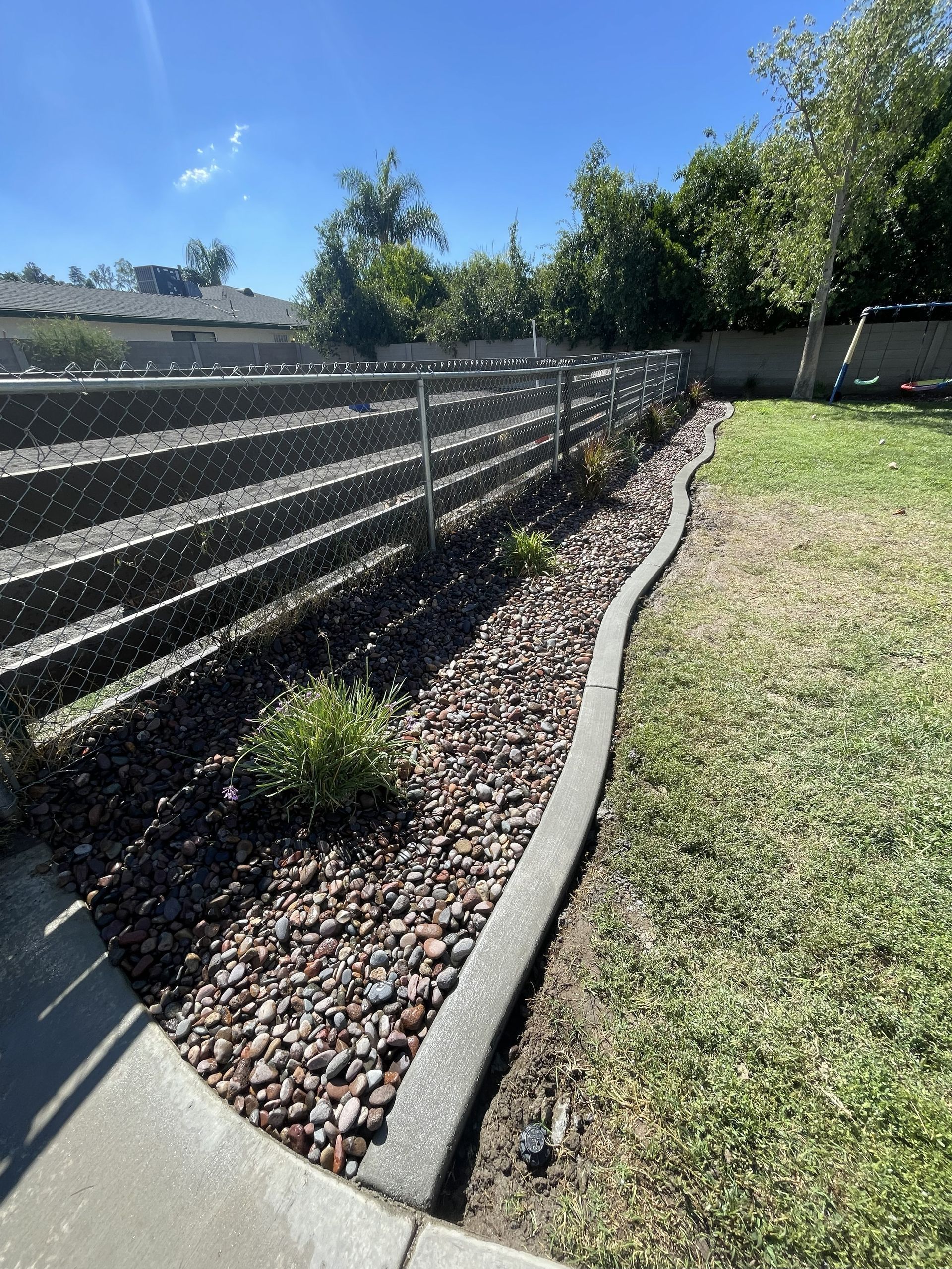 Concrete Installation, Concrete Curbing, River Rock Installation, Plant Installation, Drip Irrigation Installation, Complete Backyard Remodel