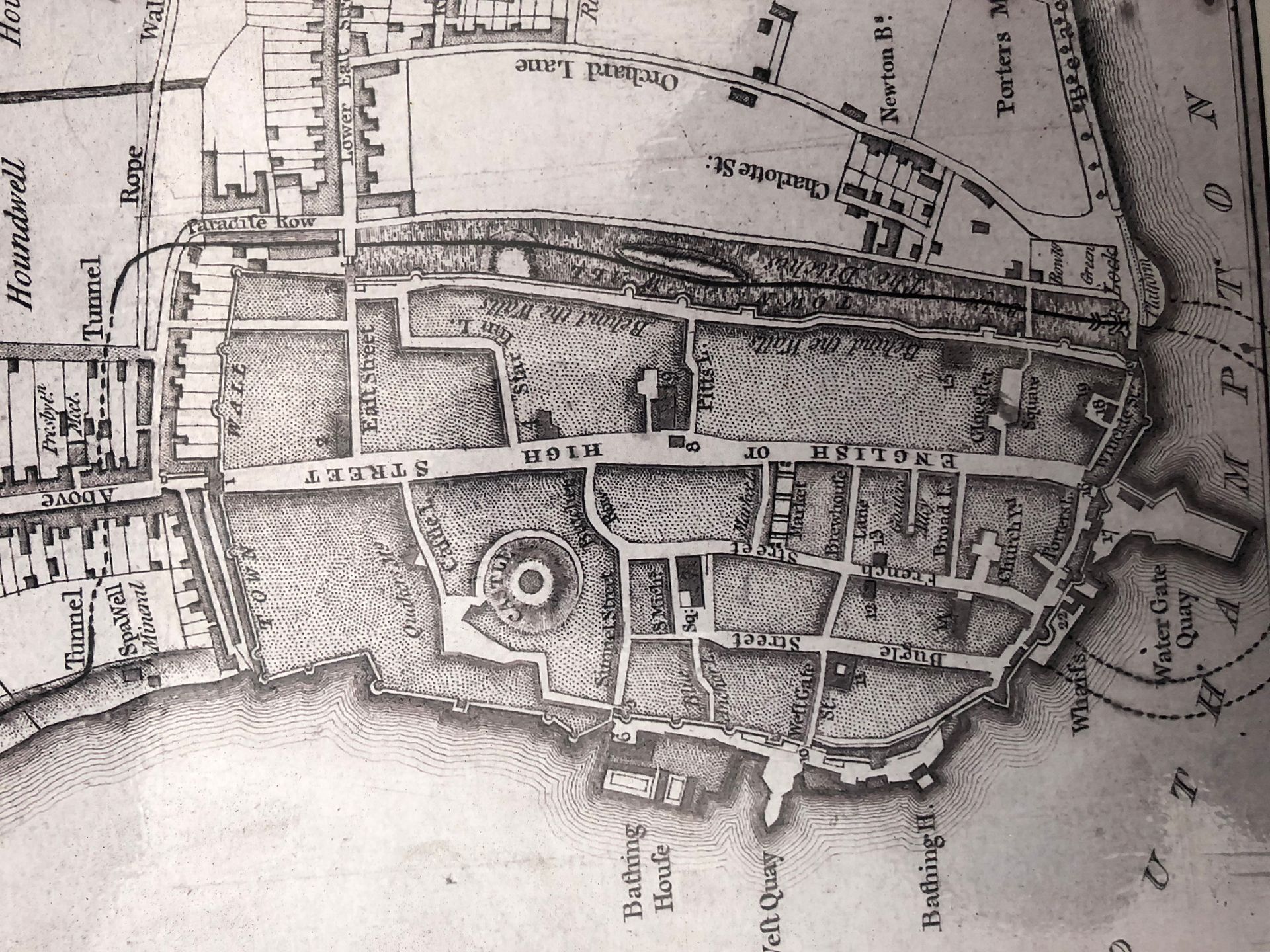 A black and white map of a city with a circle in the middle