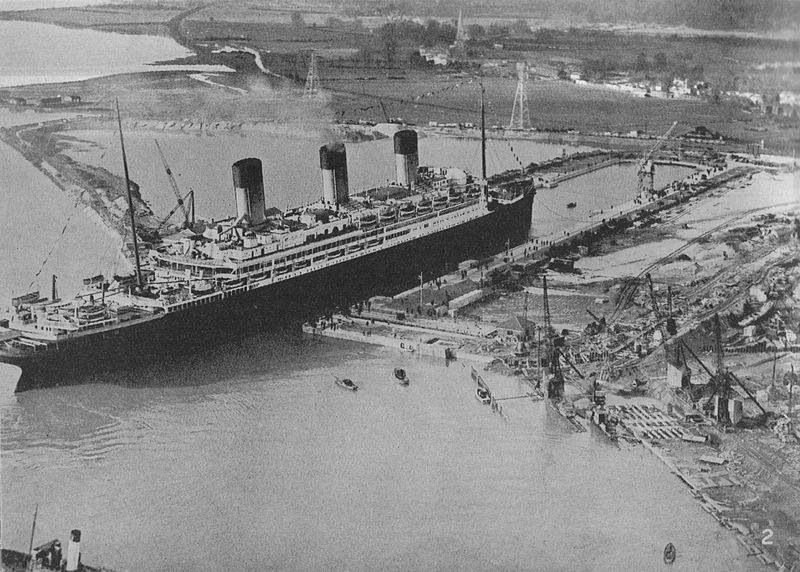 A black and white photo of a large ship in the water