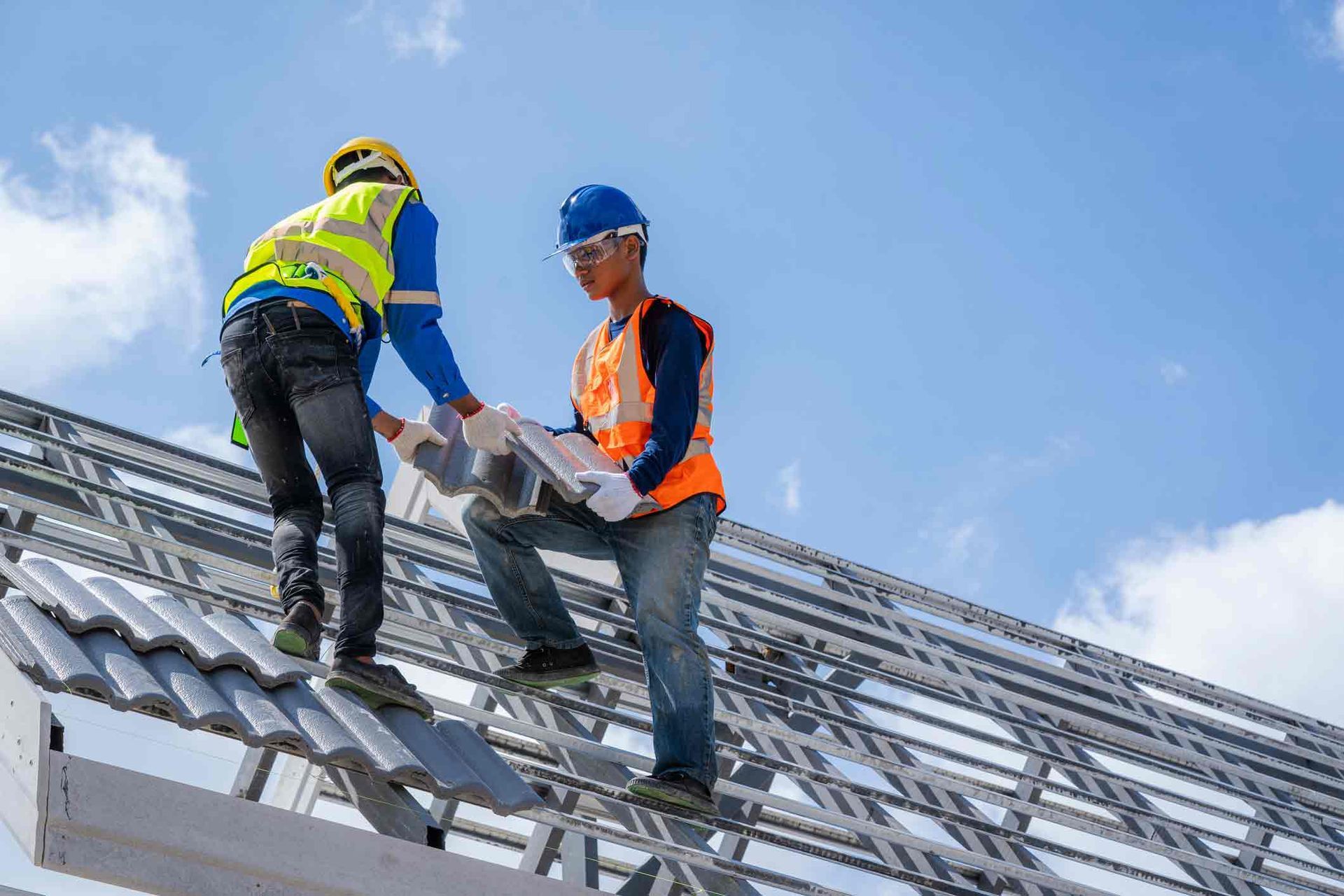 Workers Installing Roof — Cheyenne, WY — Inman Roofing Workers Installing Roof — Cheyenne, WY — Inman Roofing
