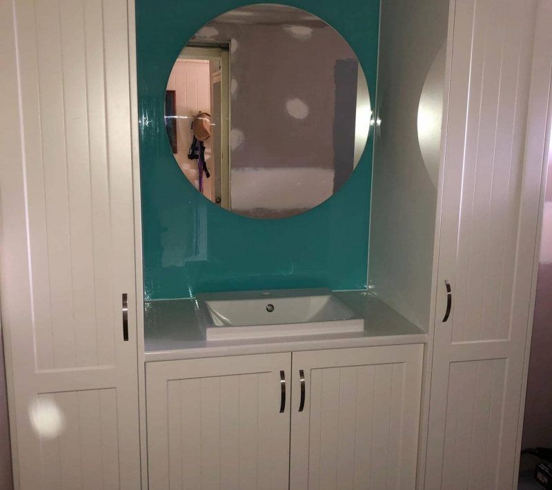 White Bathroom Vanity With a Square Sink, a Round Mirror — Craftsmen Kitchens In Monkland, QLD