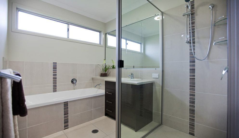Modern Bathroom With a White Bathtub, a Glass-enclosed Shower — Craftsmen Kitchens In Monkland, QLD