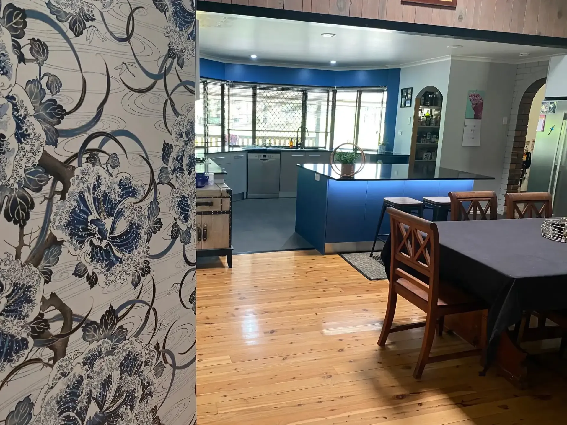 A View From a Room With Floral Wallpaper Into an Open-plan Kitchen and Dining Area — Craftsmen Kitchens In Monkland, QLD
