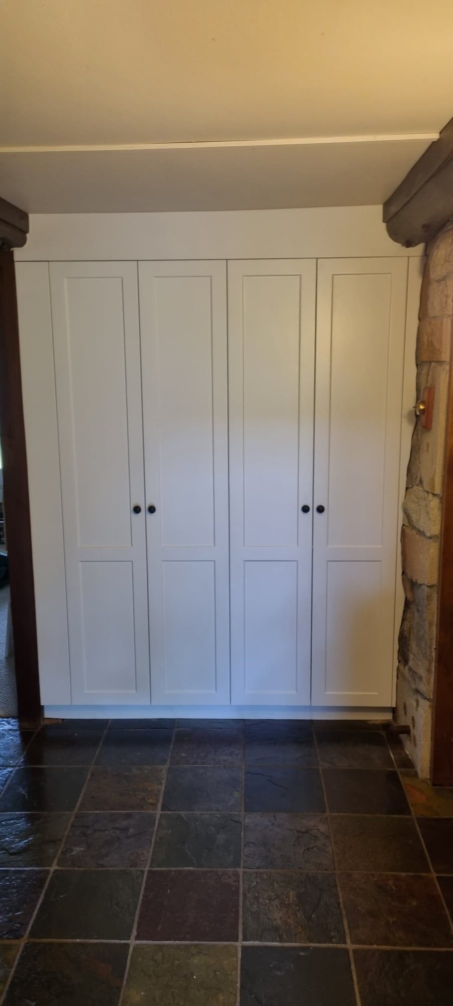 Four White, Shaker-style Wardrobe Cabinet Doors Set Against a Wall — Craftsmen Kitchens In Monkland, QLD