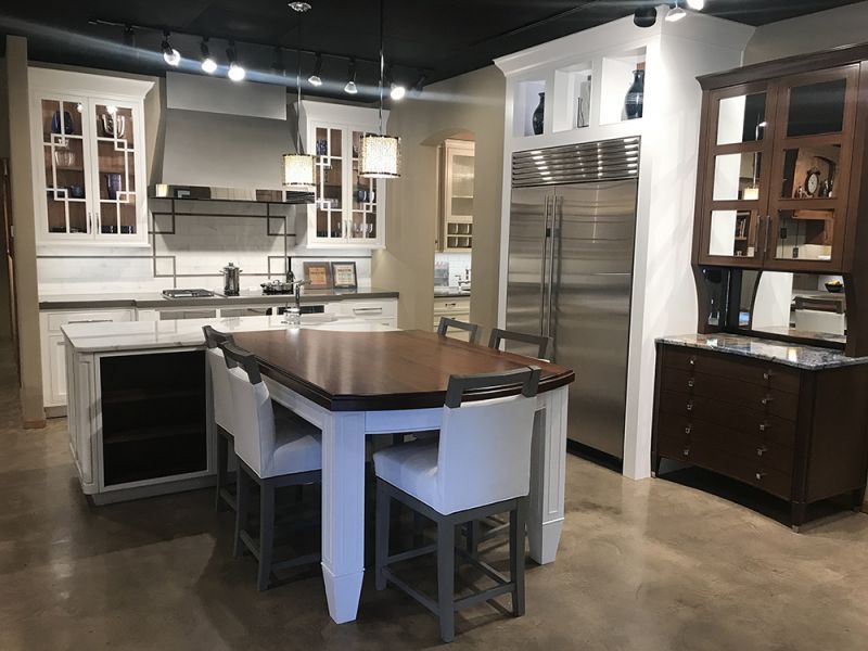 Modern kitchen with island, stainless steel appliances, and dark wood cabinets