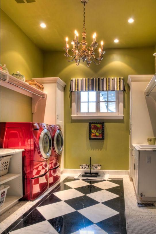 Laundry room with green walls, chandelier, window, and black-and-white checkered floor