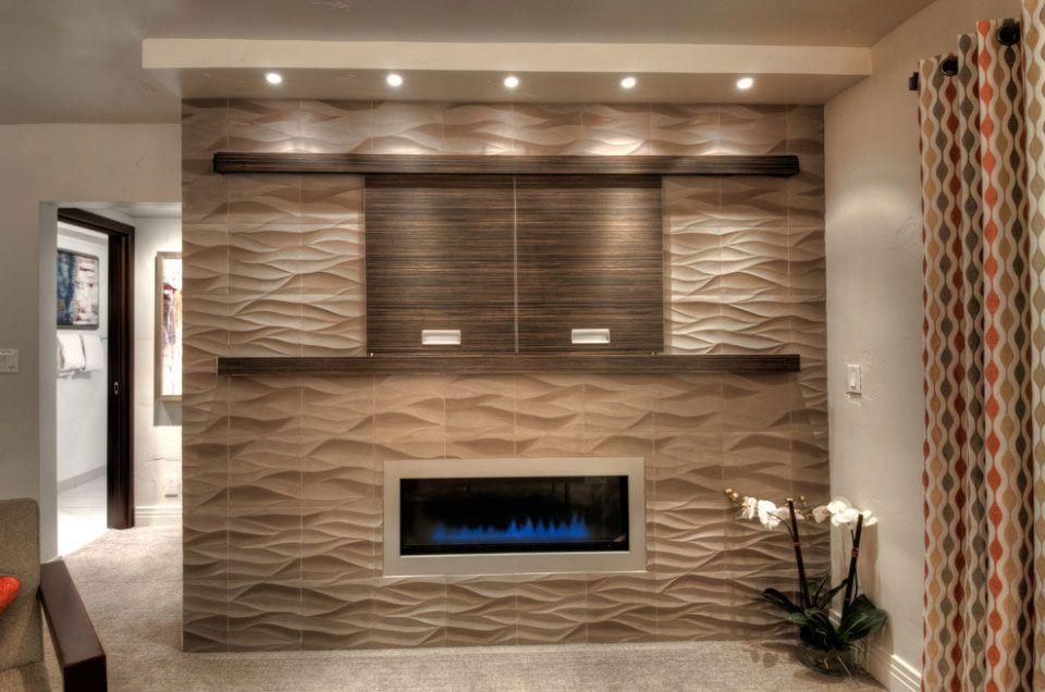 Modern living room with textured wall, built-in fireplace, wood cabinets, and recessed ceiling lights