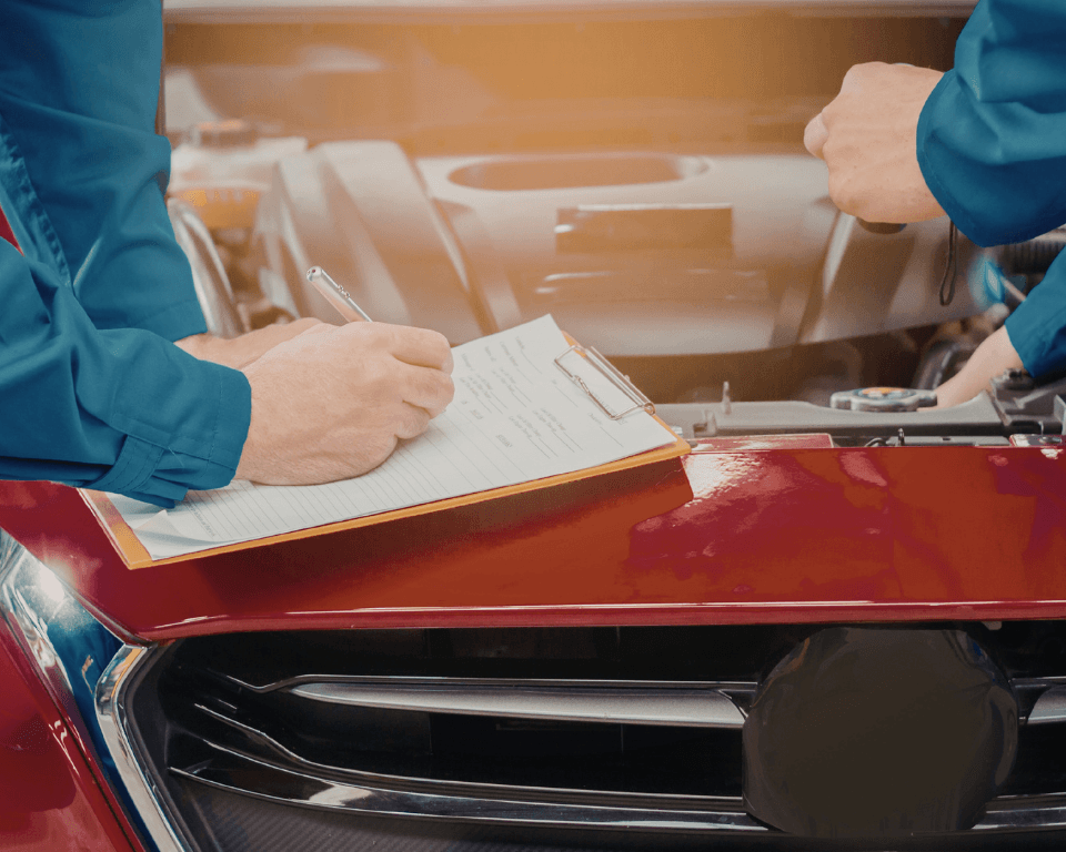 a mobile mechanic doing an engine diagnostic on-site.