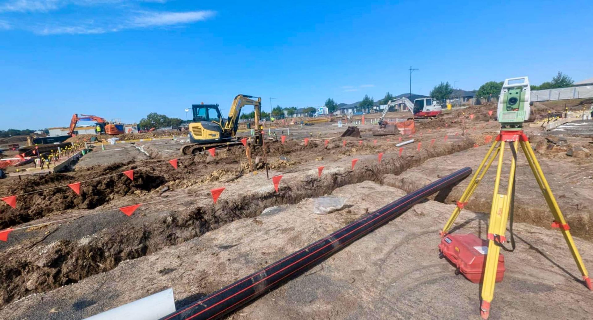 A Theodolite is Sitting on a Tripod in a Field — Point to Point Surveying In Tatura, VIC