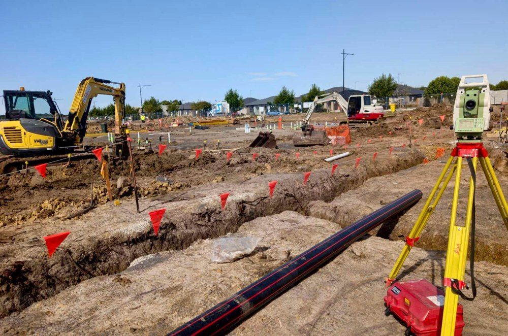 A Construction Site With A Lot Of Dirt And A Lot Of Machinery — Point to Point Surveying In Yarrawonga, VIC