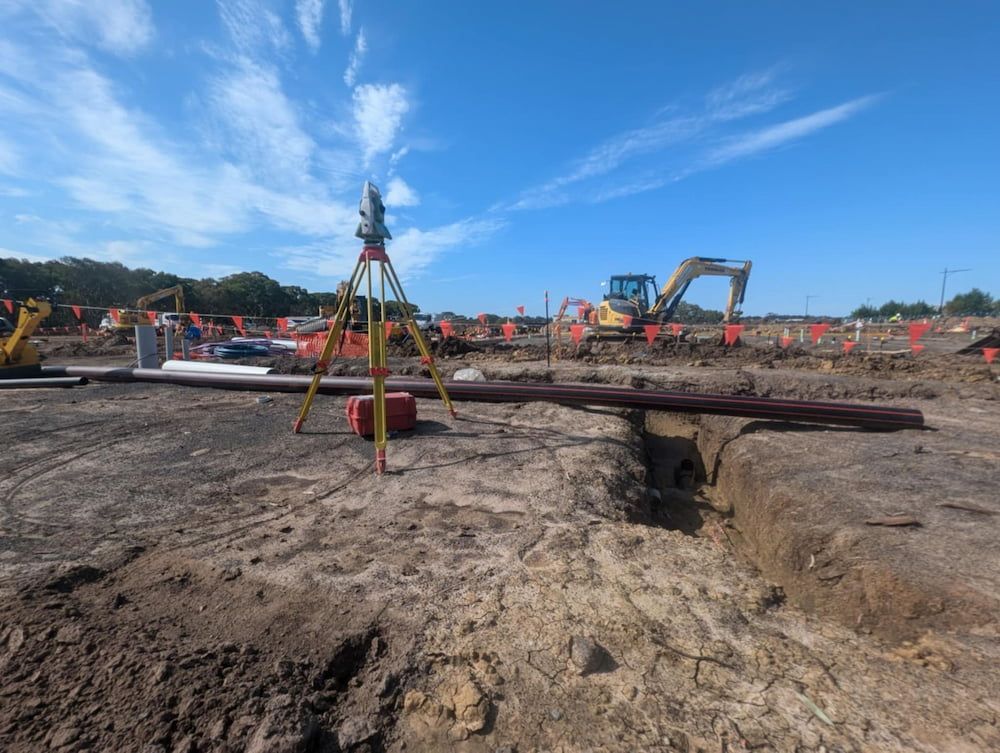 A Construction Site With a Lot of Dirt and a Lot of Machinery — Point to Point Surveying In Tatura, VIC