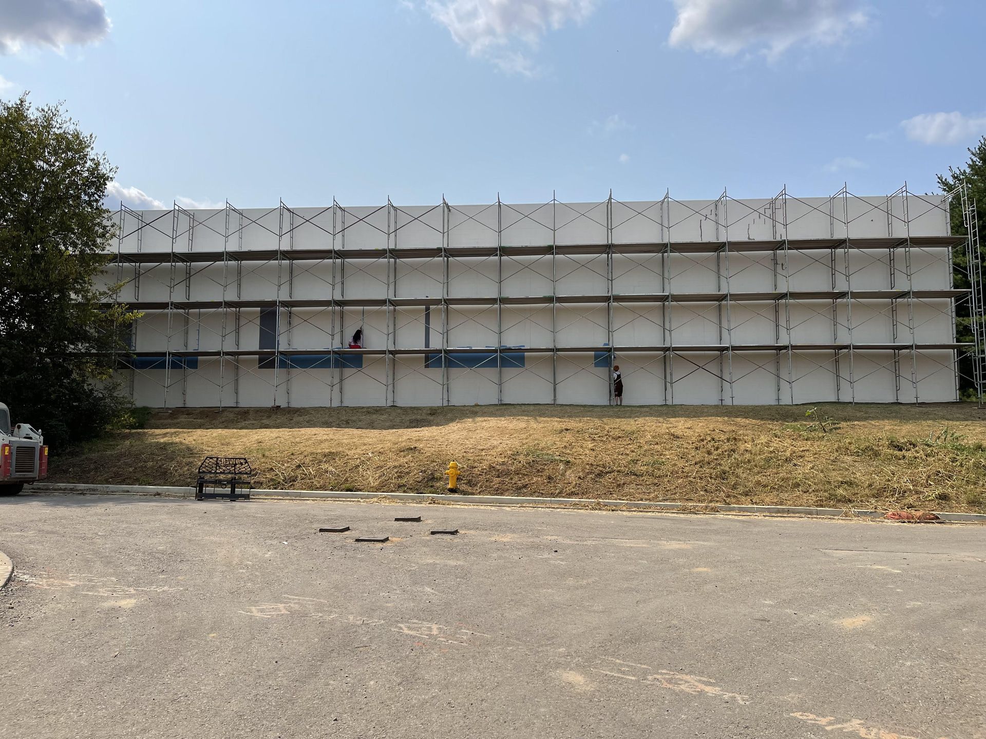 A large building is being built with scaffolding around it