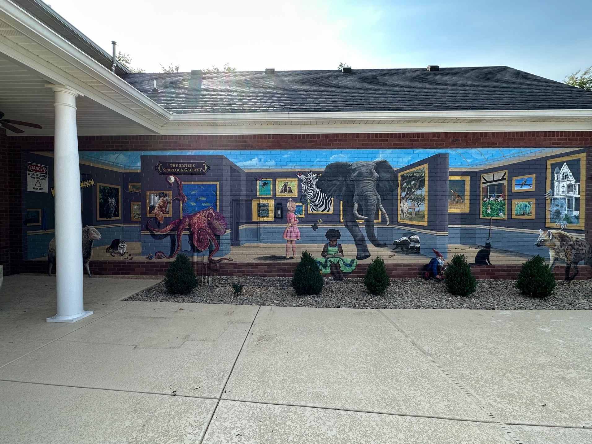 There is a large mural on the side of a building.