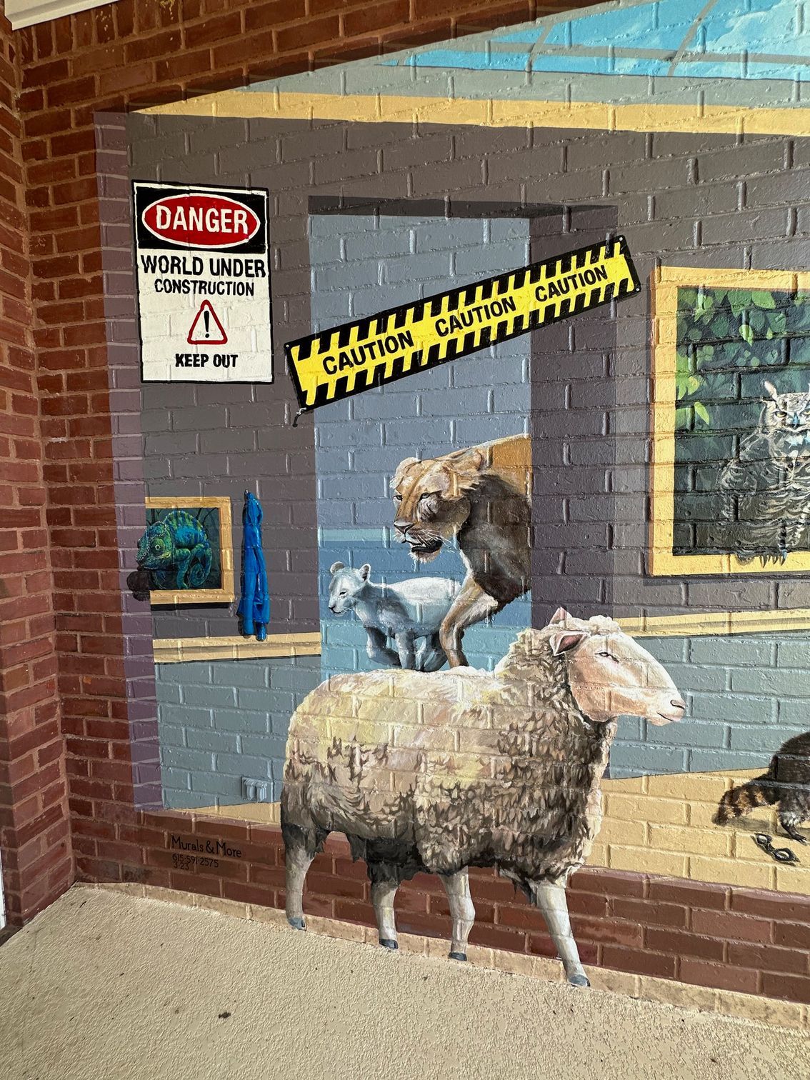 A painting of sheep standing in front of a brick wall.