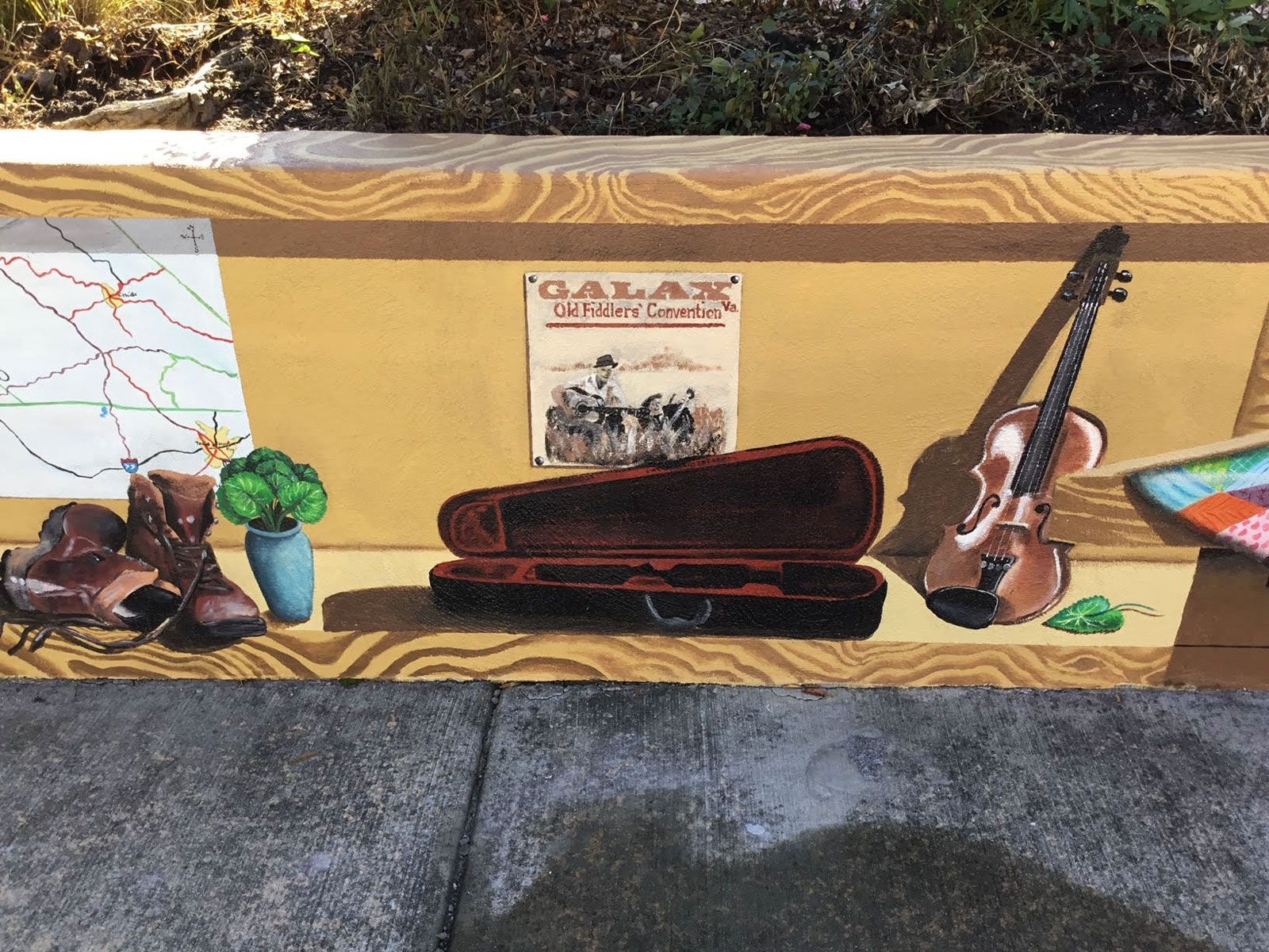 A painting of a violin in a case on a table