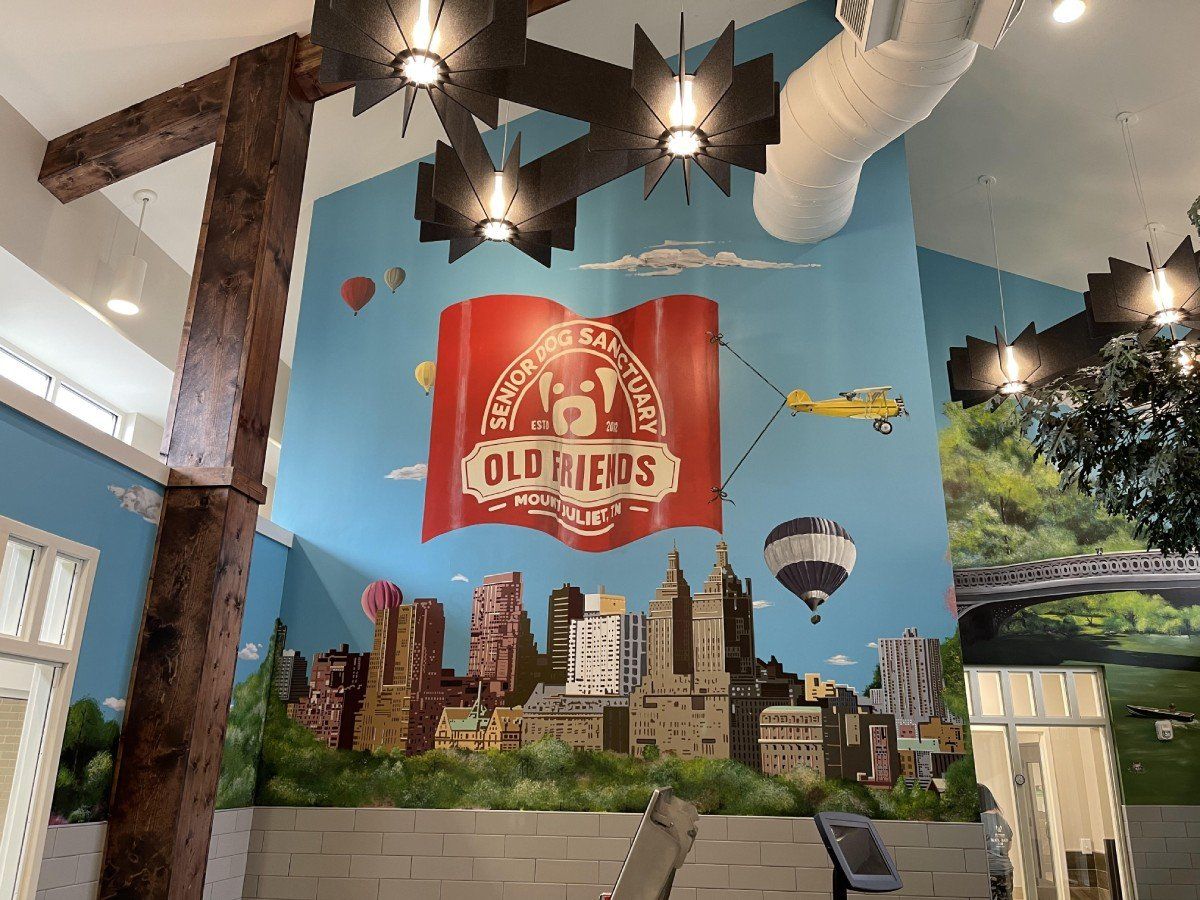 There is a mural on the wall that says old friends on it.