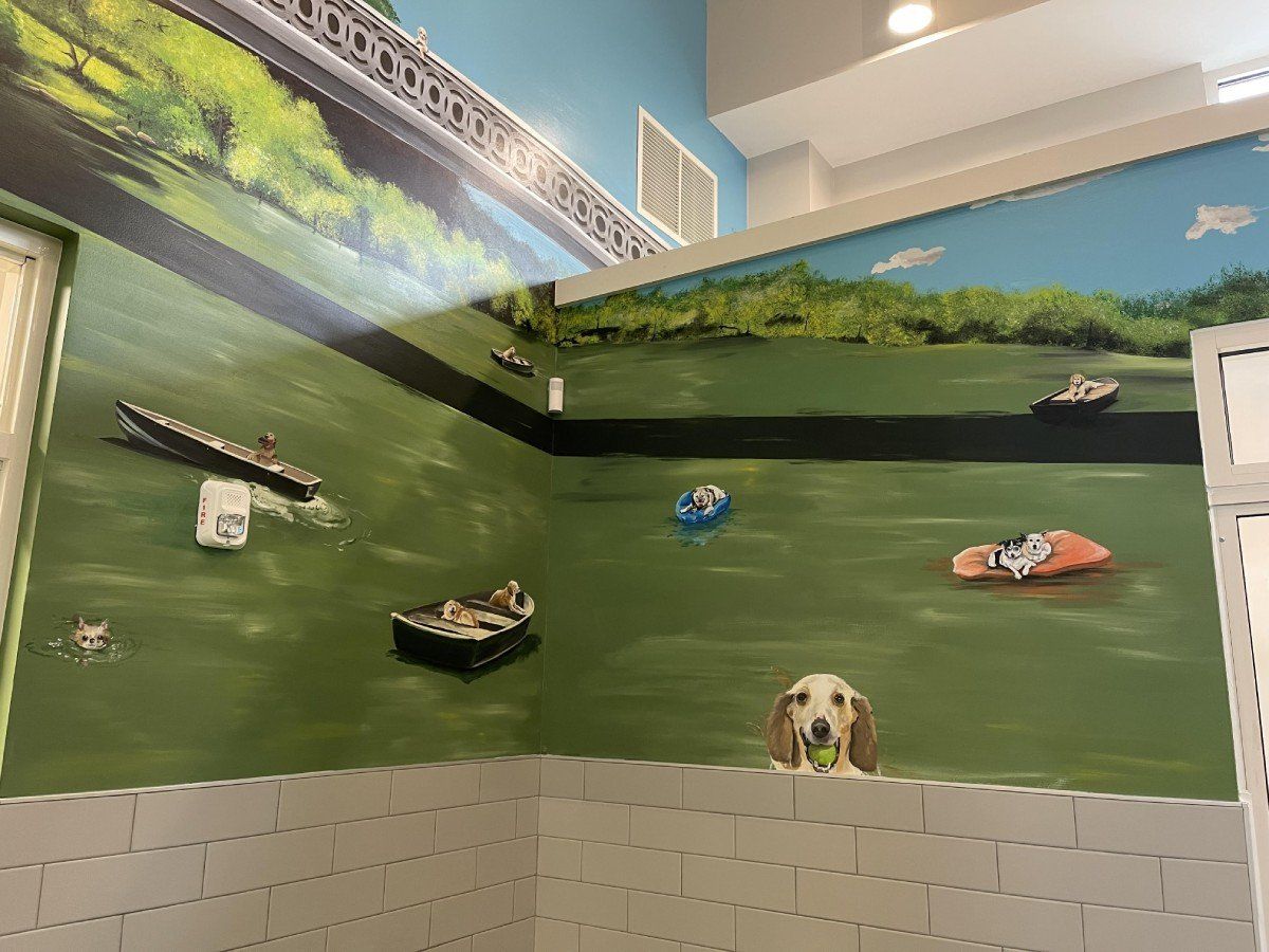 There is a painting of a dog on the wall.