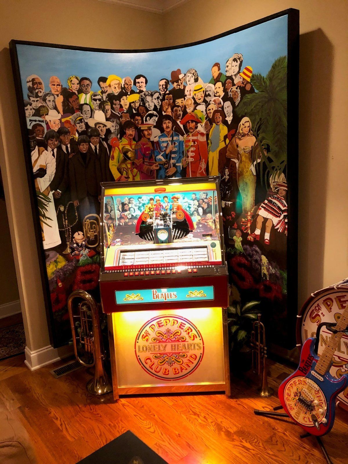 A jukebox with a picture of the beatles on it