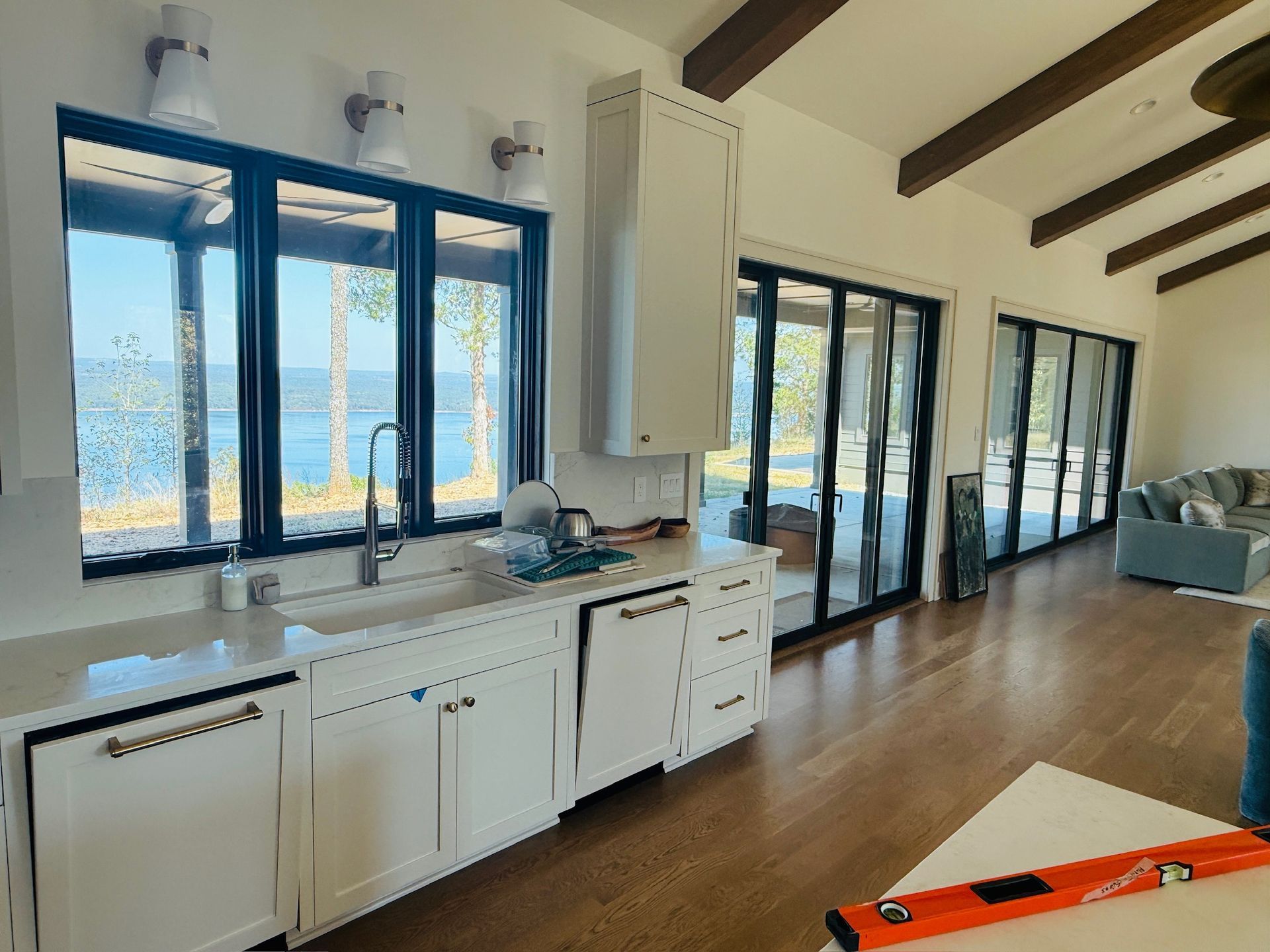 Beautiful tall windows in a kitchen and living room.