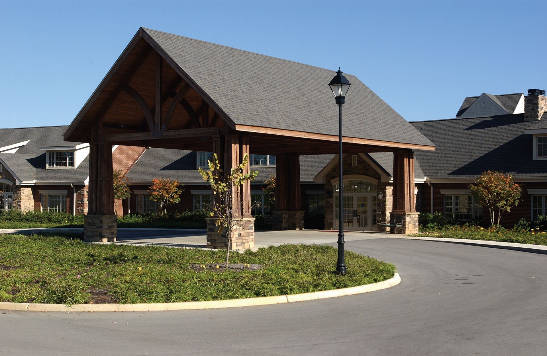 A large building with a roof that is covered in shingles