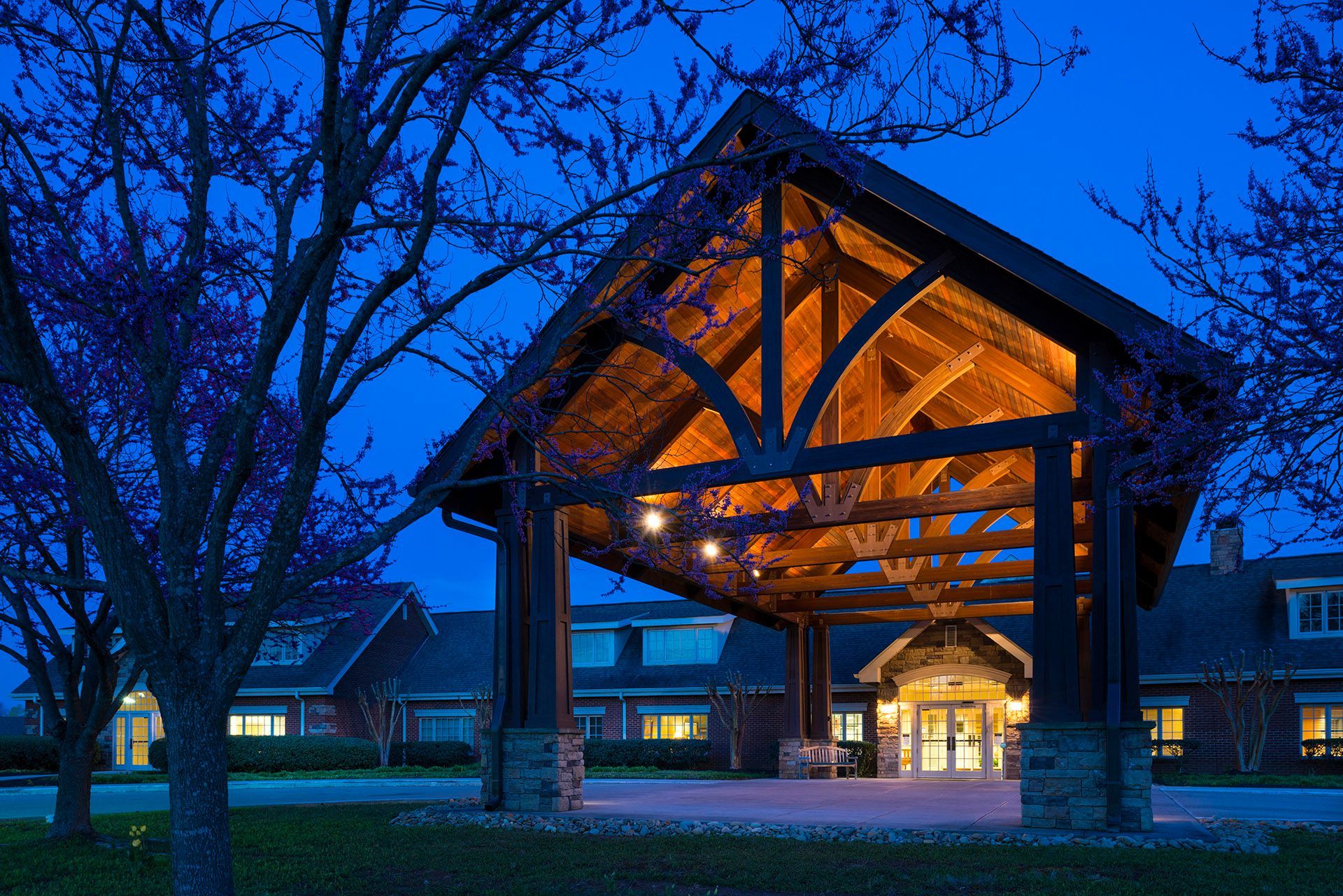A large wooden structure is lit up at night