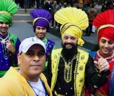 A group of people wearing turbans are posing for a picture