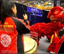 A person wearing a red jacket with the word yaolin on it