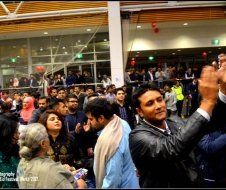 A man is taking a picture of a crowd of people.