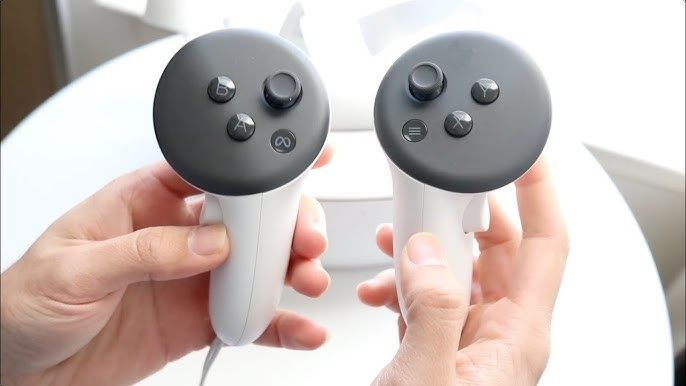 Hands holding two white MetaQuest 3s VR controllers
