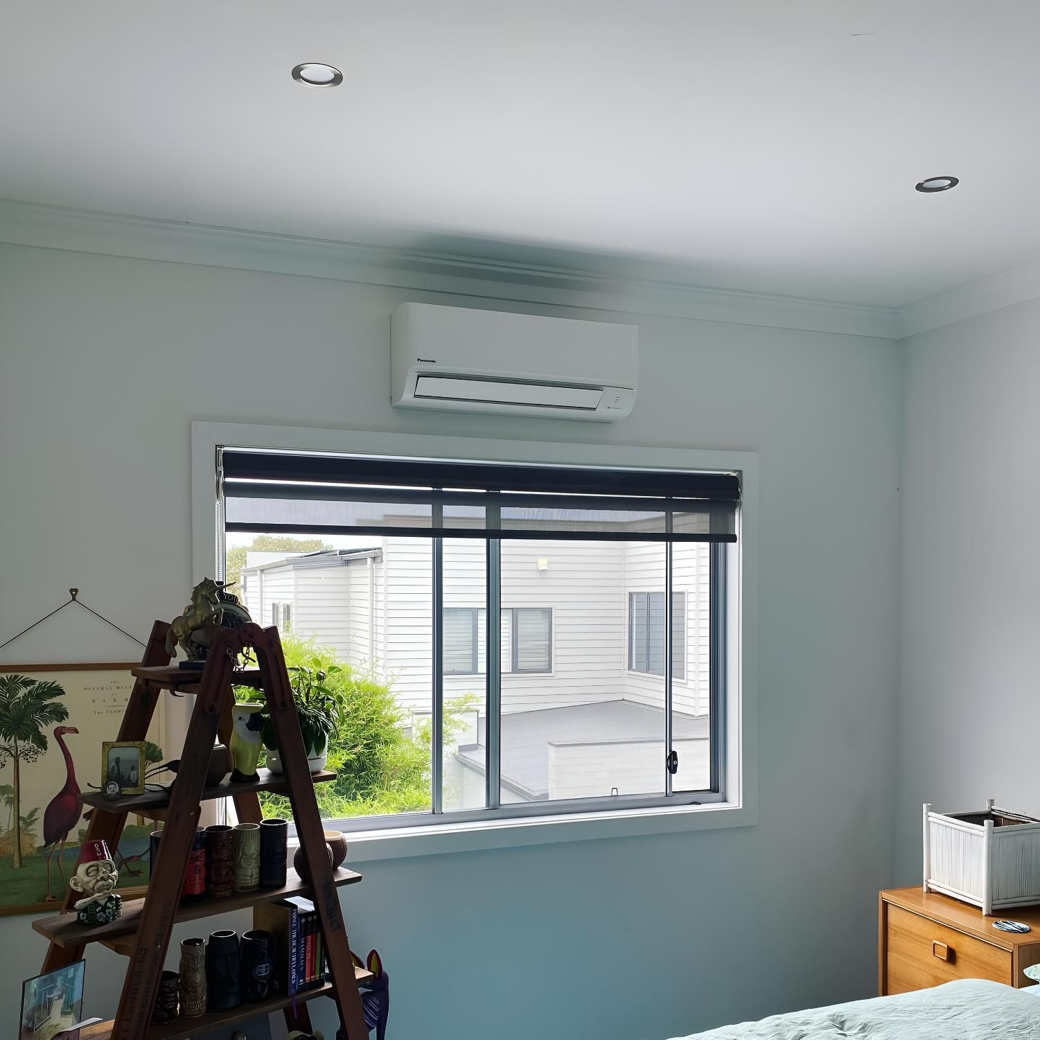 Bedroom With a Large Window and a Ladder — Kiama Air Conditioning in Kiama, NSW