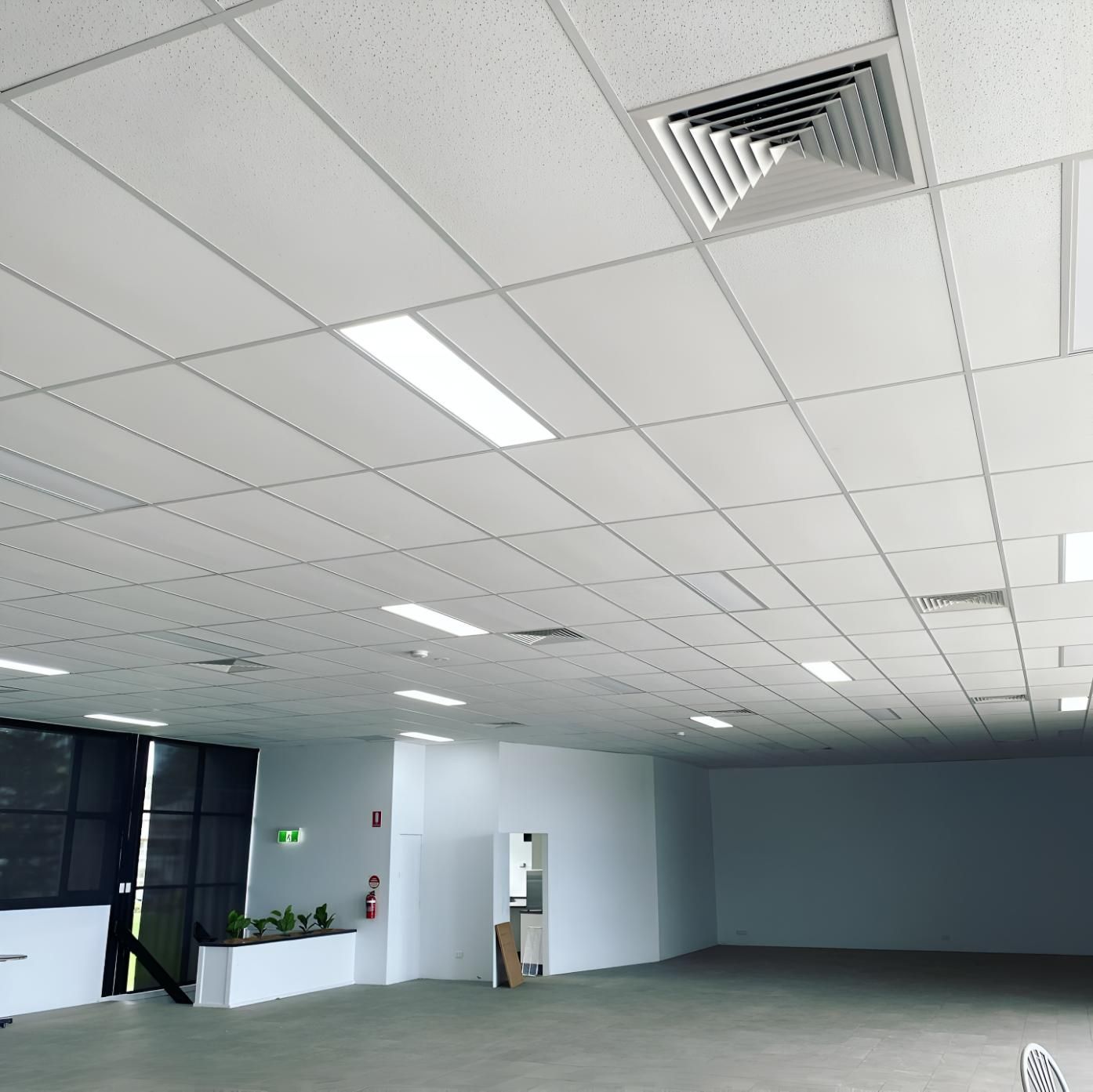 Large Empty Room With a White Ceiling — Kiama Air Conditioning in Shellharbour, NSW