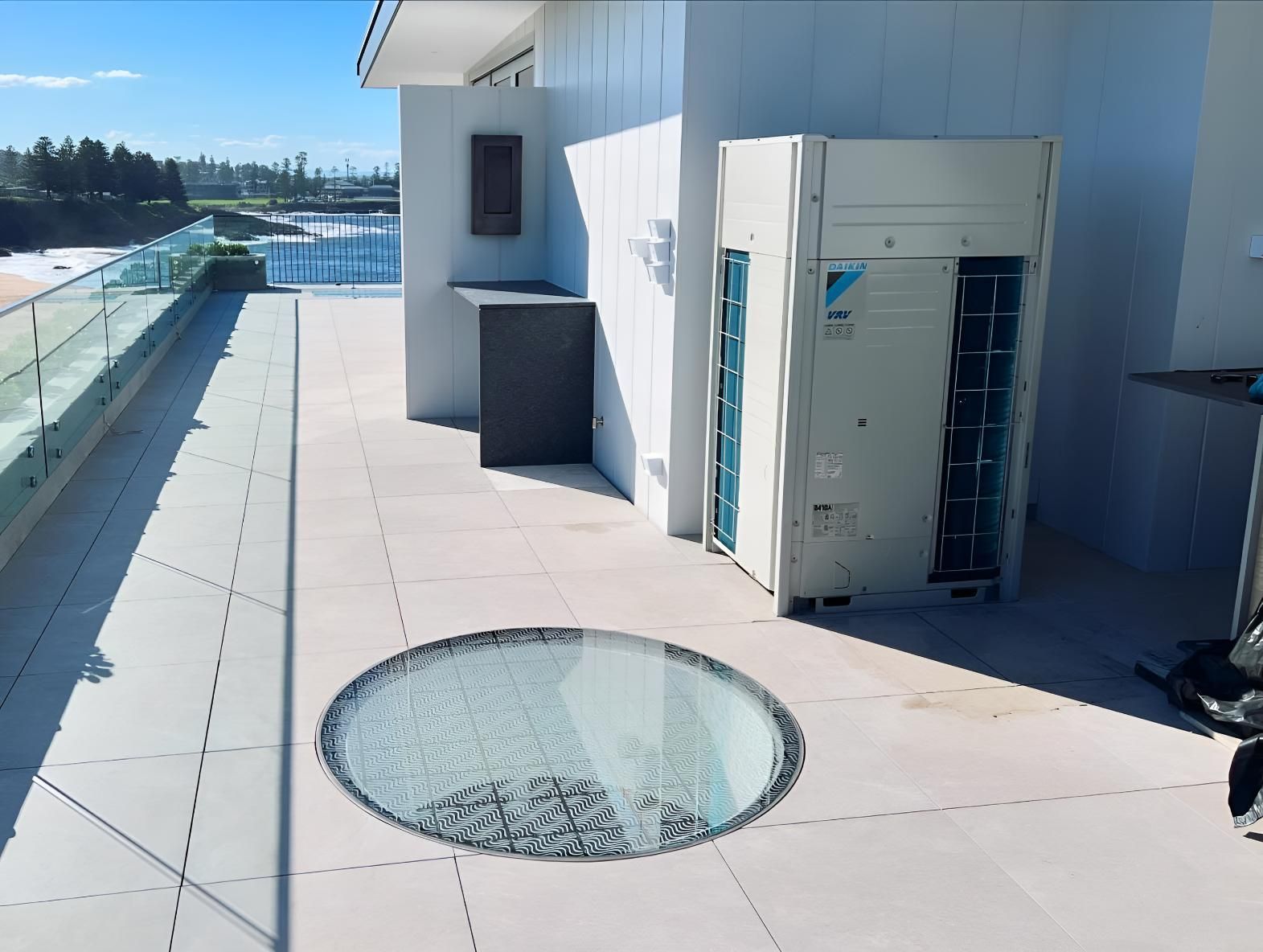Rooftop With a Circular Hole in the Middle of It — Kiama Air Conditioning in Albion Park Rail, NSW