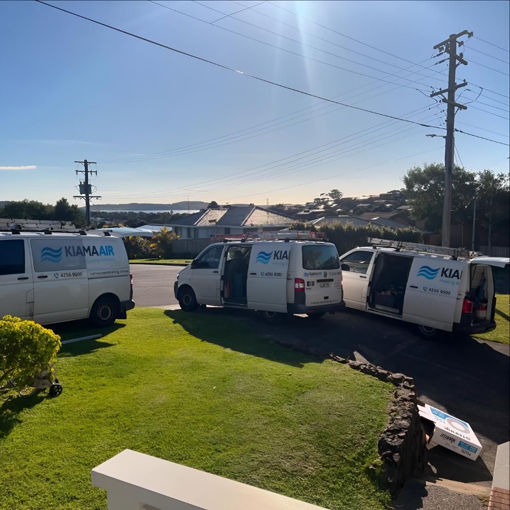 Row of White Vans Parked on the Side of the Road — Kiama Air Conditioning in Albion Park Rail, NSW