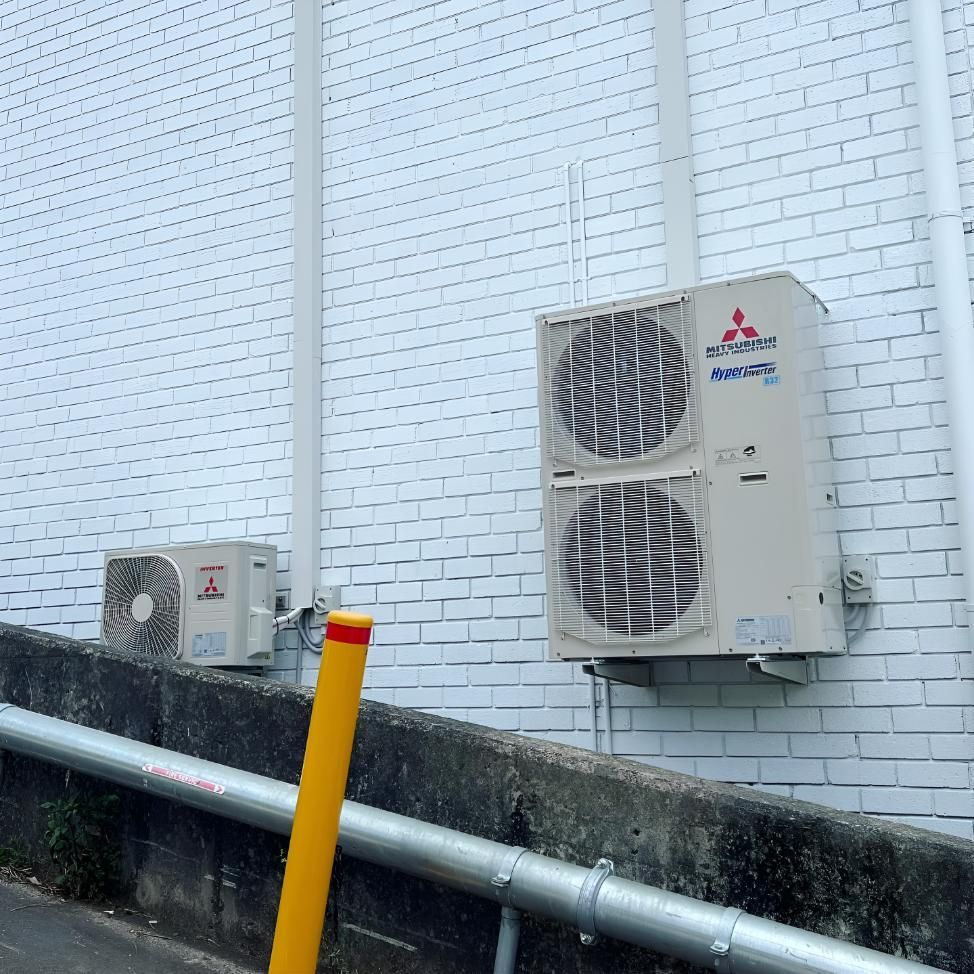 Mitsubishi Air Conditioner is Mounted on Brick Wall — Kiama Air Conditioning in Albion Park Rail, NSW