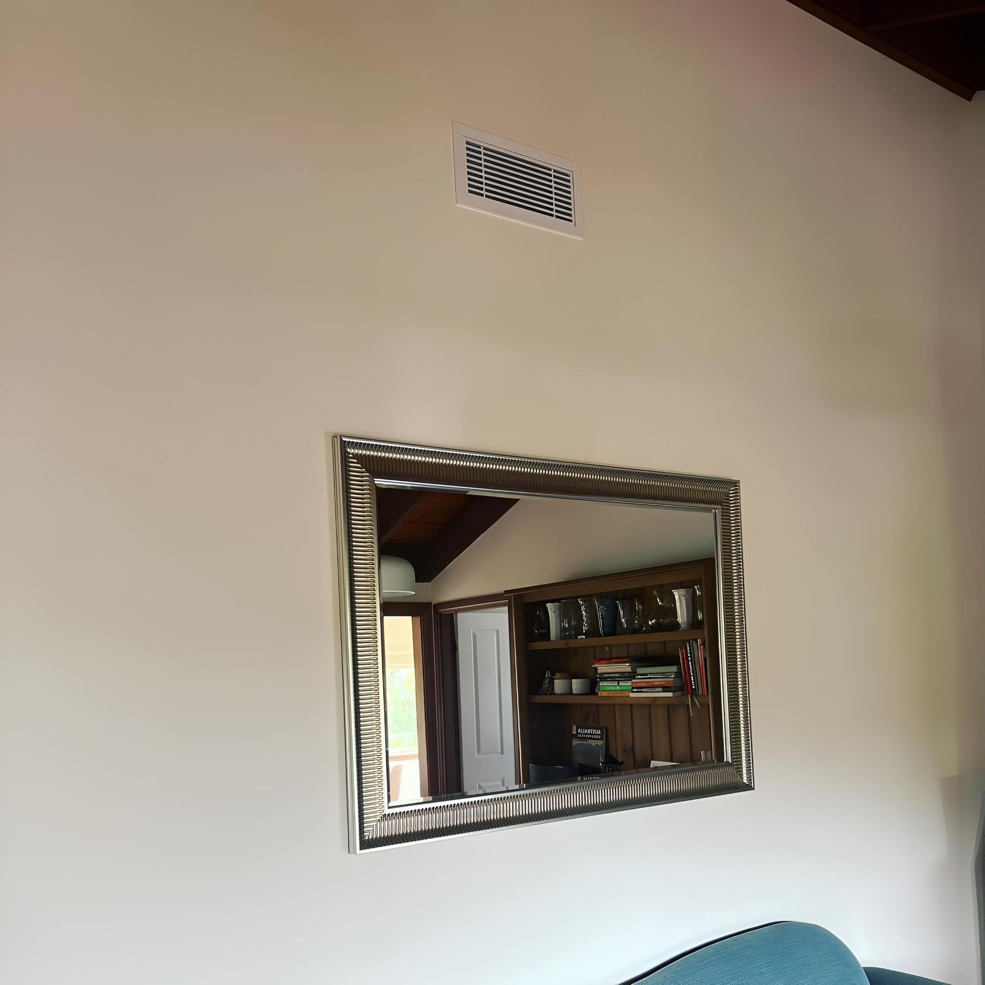 Living Room With a Large Mirror on the Wall — Kiama Air Conditioning in Albion Park Rail, NSW