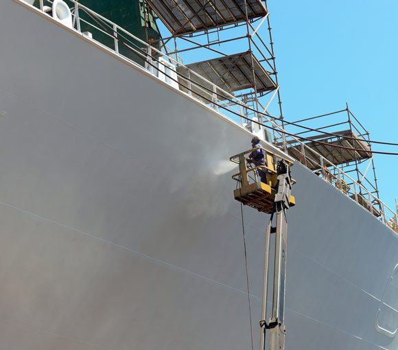 Worker Painting Ship — Powder coating service in Maitland, NSW