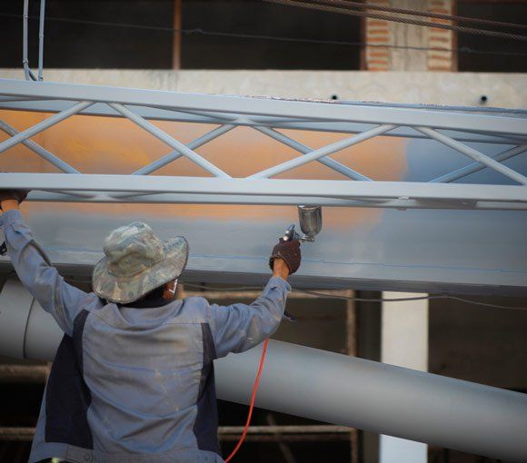 Man Working on Commercial Building — Powder coating service in Newcastle, NSW